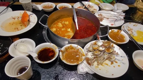 Lots of empty plates after a hot pot dinner Stock Footage 123623530