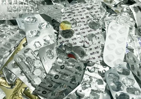 Lots of empty used pill blisters. The concept garbage sorting, environment Stock Photos