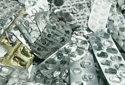 Lots of empty used pill blisters. The concept of garbage sorting Stock Photos