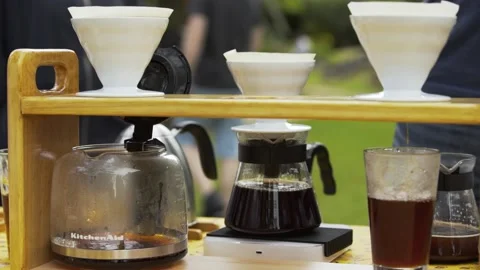 Lots of Filter coffee pouring into cups Stock Footage 157577993