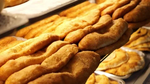 Lots of fried chebureks on the counter in the dining room or on the buffet Stock Footage 319431135