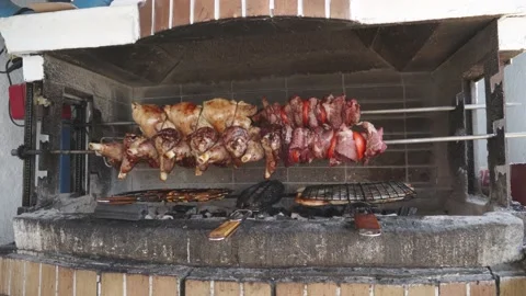 Lots of fried meat spit on a skewer with vegetables close-up Stock Footage 159586785