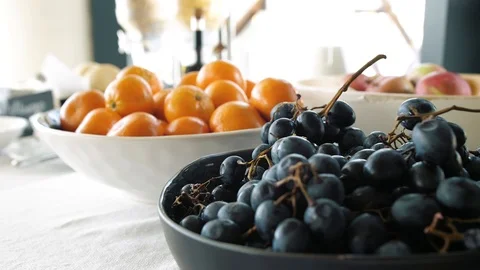 Lots of fruit in plates on the table Stock Footage 127529615