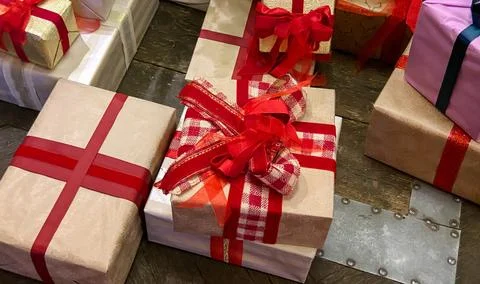 Lots of gift boxes in red and beige tones. Festive concept Stock Photos