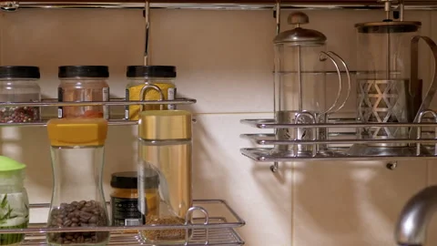 Lots of Glass Spice Jars, Kitchen Utensils, Located in Kitchen Railing System Stock Footage 148820361