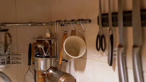 Lots of Glass Spice Jars, Kitchen Utensils, Knives Located in Railing System Stock Footage 148820937