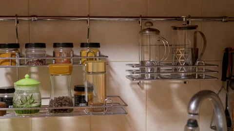 Lots of Glass Spice Jars, Kitchen Utensils, Located in Kitchen Railing System Stock Footage 149789087