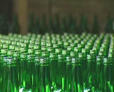 Lots of green bottle being prepared for packaging in factory. Stock Footage