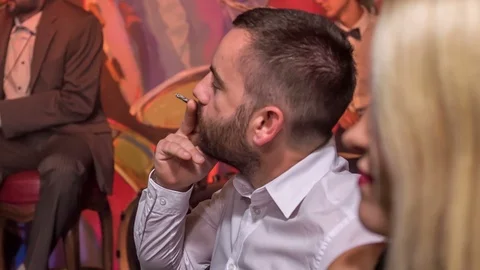 Lots of guests are drinking and smoking in this bar Stock Footage 112188651