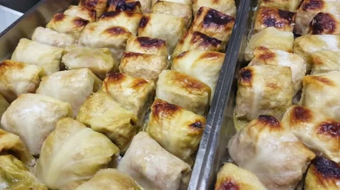 Lots of handmade cabbage rolls, getting prepared for lunch, at a restaurant k Stock Footage 62847070