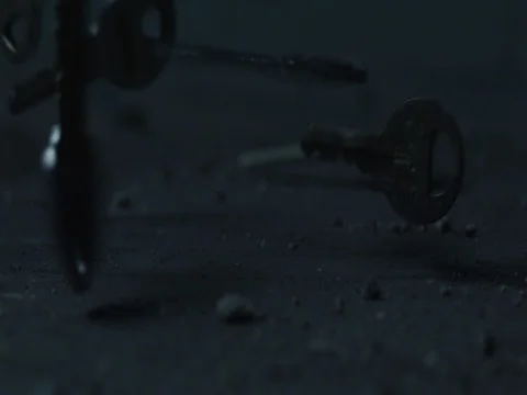 Lots of Keys falling on the floor. Slow motion, macro close up. Stock Footage 70212882