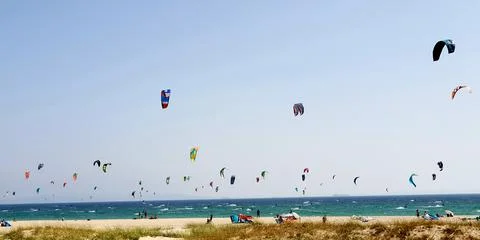 Lots of kites flying with the wind Stock Photos