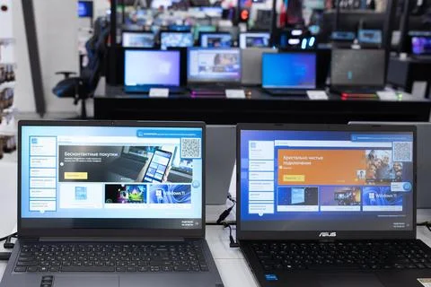 Lots of laptops in a big electronics store Stock Photos