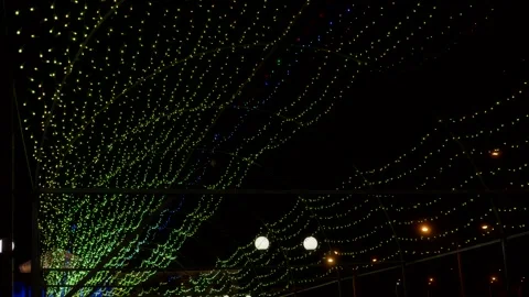 Lots of light bulbs flickering in different colors. Illumination Stock Footage 146446537