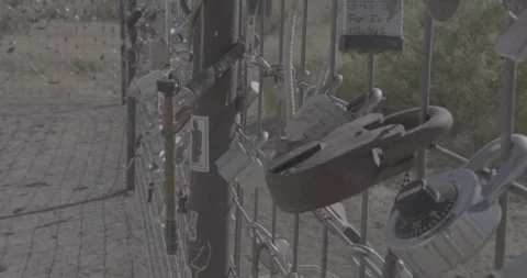 Lots of Locks on an Old Fence in the Middle of the Desert Stock Footage 246433766