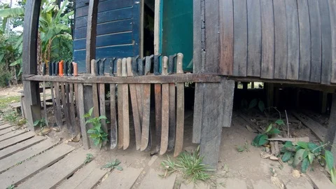 Lots of machetes outside a lode at amazon rain forest jungle. Puerto Maldonado Stock Footage 94099419