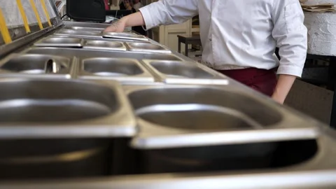 Lots of metal containers with various ingredients in the pizzeria. Stock Footage 307389412