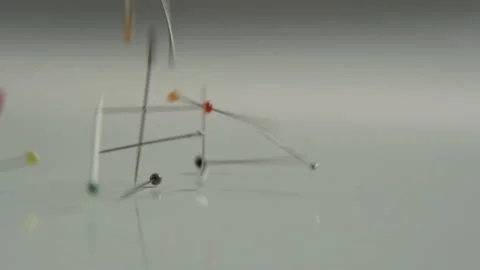 Lots of Needles Being Thrown on a Gradient Grey Surface Stock Footage 89731295