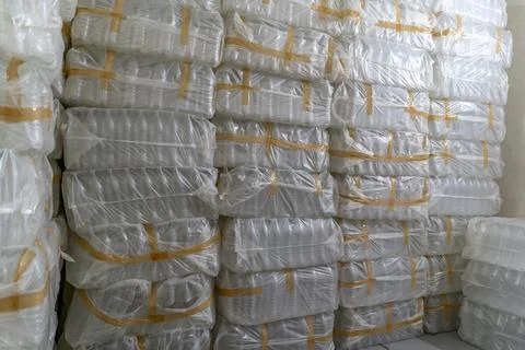 Lots of pallets of empty plastic bottles. Stock Photos