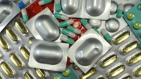Lots of pills in 4K Stock Footage 140328014