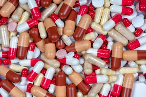 Lots of pills of different types and colors Stock Photos