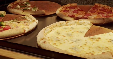 Lots of Pizza slice on the Table in a Pizzeria. Delicious Pizza. Stock Footage 256663547