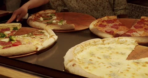 Lots of Pizza slice on the Table in a Pizzeria. Delicious Pizza. Stock Footage 267834274