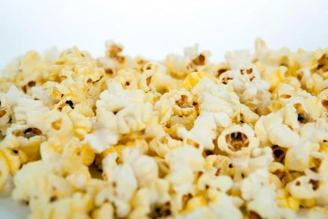 Lots of popcorn on white Stock Photos