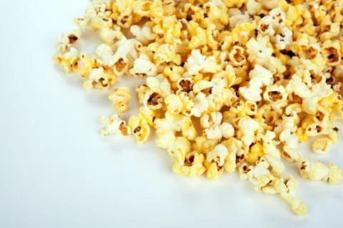 Lots of popcorn on white Stock Photos