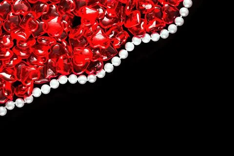 Lots of red hearts and string of pearls Stock Photos