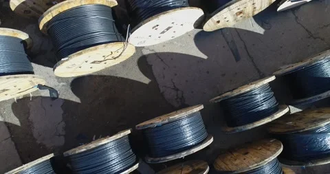 Lots of reels with cable. Flying over reels with cable. Cable factory Stockbeeldmateriaal 140746793