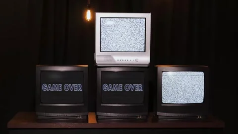 Lots of retro TVs with static noise and game over sign and glitch effect Stock Footage 272289947
