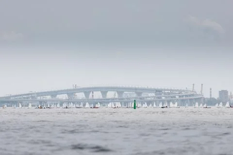 Lots of sailing derricks on the horizon on a clear sunny day, young Stock Photos
