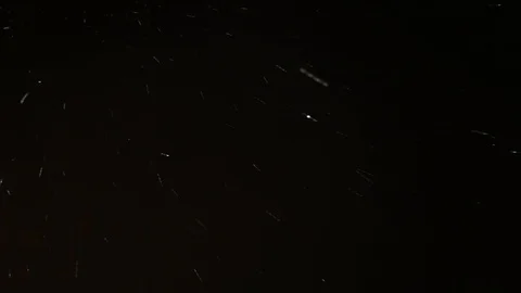 Lots of Snowflakes Falling from the Night Sky Background Stock Footage 122624646