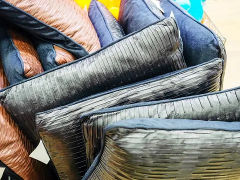 Lots of soft square decorative pillows. Photo close-up in full screen Stock Photos