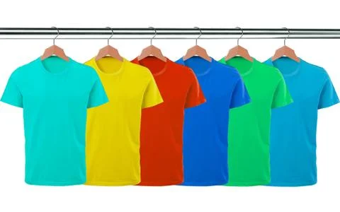 Lots of T-shirts on hangers isolated on white Foto stock