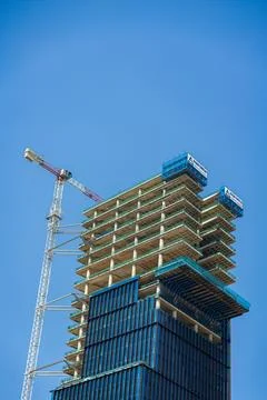 Lots of tower Construction site with cranes and building with blue sky back.. Stock Photos