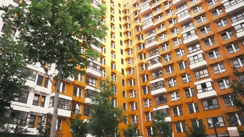 Lots of trees inside the private grounds of a multifamily apartment complex Stock Footage 223130293