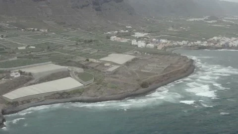 Lots of waves repeating non stop. Volcanic coast. Aerial view. Drone shot. RAW Stock Footage 158888563