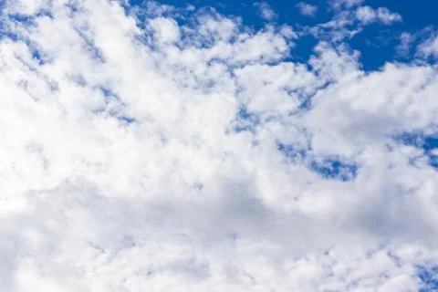Lots of White clouds with light shadow on a blue sky Stock Photos