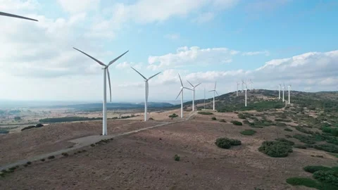 Lots of windmills producing electricity on the pass. Large wind turbines with Stock Footage 165396556
