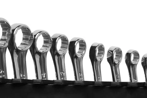 Lots of wrenches isolated on white background. Industrial background. Stock Photos