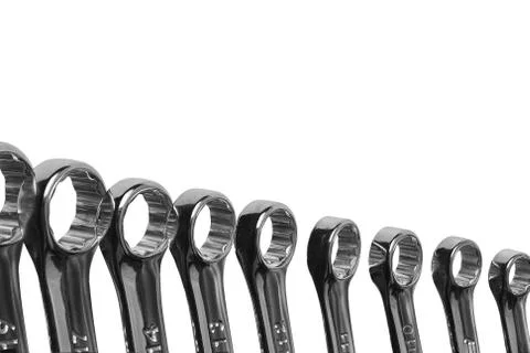 Lots of wrenches isolated on white background. Industrial background. Stock Photos