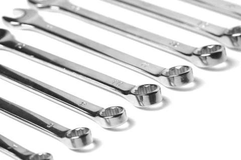Lots of wrenches isolated on white background. Industrial background. Stock Photos