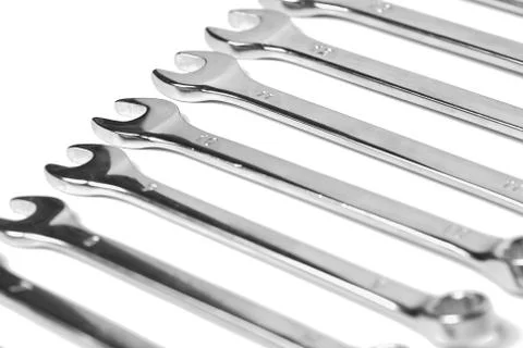 Lots of wrenches isolated on white background. Industrial background. Stock Photos