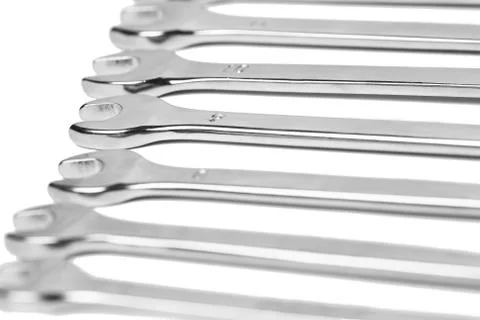Lots of wrenches isolated on white background. Industrial background. Stock Photos