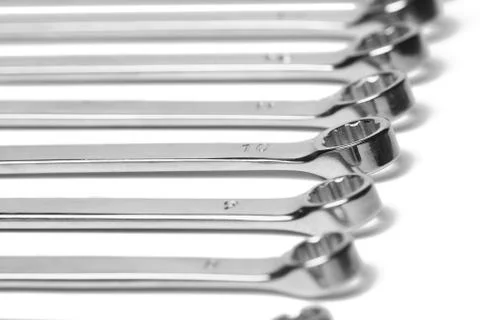 Lots of wrenches isolated on white background. Industrial background. Stock Photos