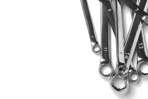 Lots of wrenches isolated on white background. Industrial background. Stock Photos