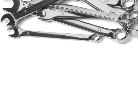 Lots of wrenches isolated on white background. Industrial background. Stock Photos