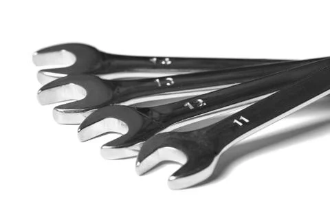 Lots of wrenches isolated on white background. Industrial background. Stock Photos